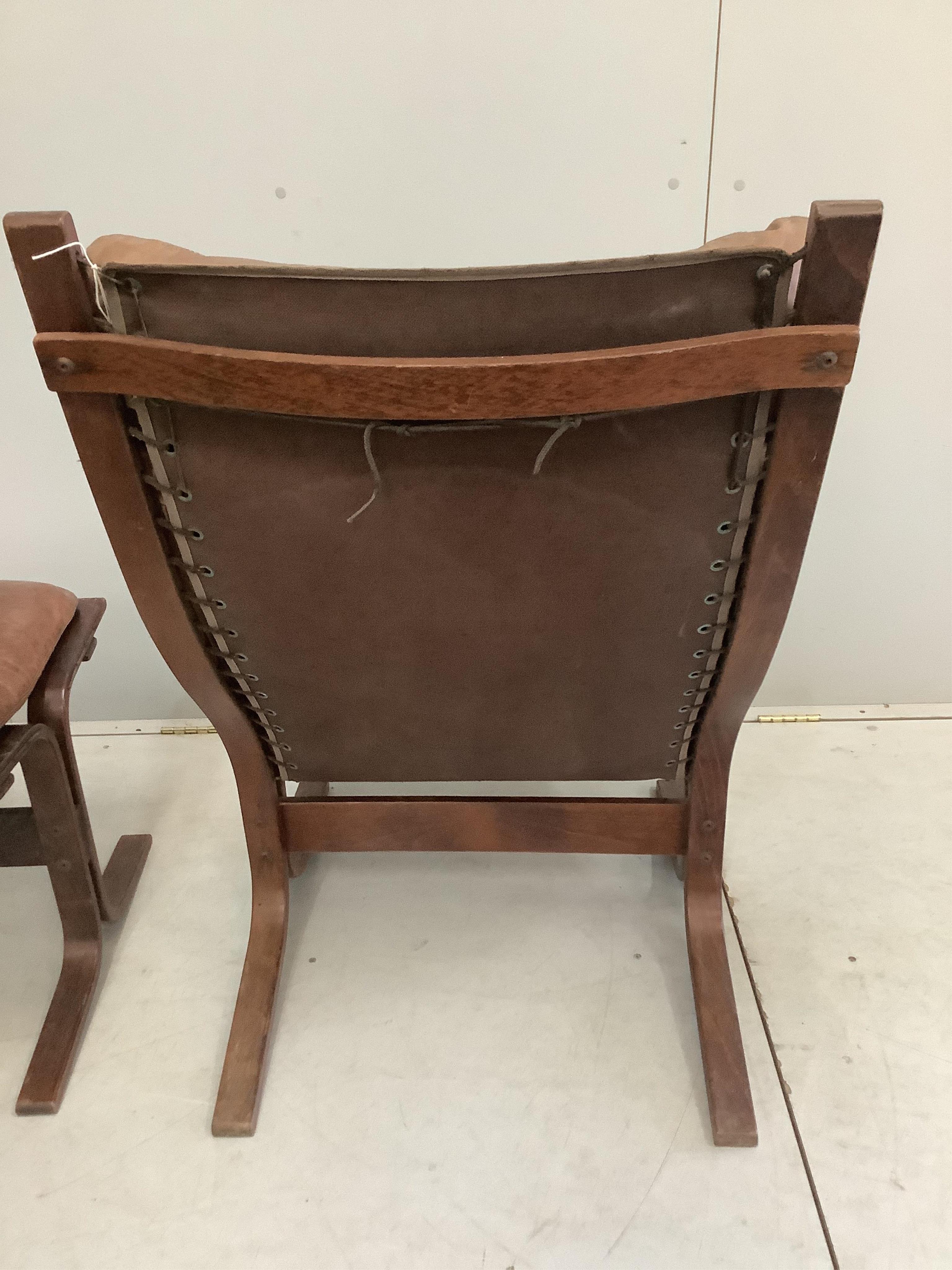 An Ingmar Relling leather chair, width 62cm, depth 66cm, height 98cm and footstool, Siesta